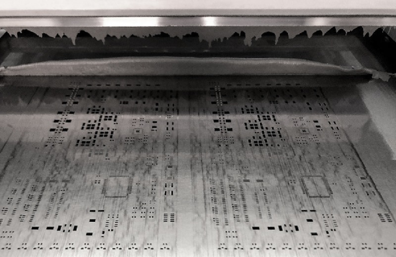 Screen printing foil with holes for dispensing solder.